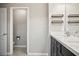 Bathroom with a view of the toilet and vanity with wall shelving at 3207 Stratton Cir, Kissimmee, FL 34744
