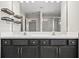 Bathroom vanity with dual sinks, contemporary lighting, and modern finishes at 3207 Stratton Cir, Kissimmee, FL 34744