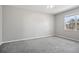 Inviting bedroom with plush carpet, neutral walls, ceiling fan, and window, providing a comfortable retreat at 3207 Stratton Cir, Kissimmee, FL 34744