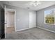 Bedroom featuring neutral paint, carpeted floor, and a view of an adjoining room at 3207 Stratton Cir, Kissimmee, FL 34744