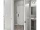 View of an entryway with a white door adjacent to the powder room at 3207 Stratton Cir, Kissimmee, FL 34744