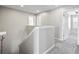 Upstairs hallway with neutral walls and plush carpeting, leading to bedrooms at 3207 Stratton Cir, Kissimmee, FL 34744