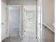 Hallway featuring carpeted floors and doors leading to different rooms at 3207 Stratton Cir, Kissimmee, FL 34744