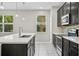Kitchen showcasing a central island, stainless steel appliances, and a view to the outside at 3207 Stratton Cir, Kissimmee, FL 34744