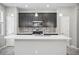 Kitchen boasts stainless appliances, tile backsplash, dark cabinets, and an island sink at 3207 Stratton Cir, Kissimmee, FL 34744