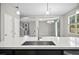 Kitchen island with a stainless steel sink overlooking the living and dining areas at 3207 Stratton Cir, Kissimmee, FL 34744