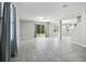 Bright and airy open-concept living room with tile flooring and sliding door to the backyard at 3207 Stratton Cir, Kissimmee, FL 34744