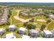 Aerial view of community near golf course at 7770 Sandy Ridge Dr # 110, Reunion, FL 34747