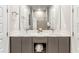 Double vanity bathroom with modern gray cabinets and a spacious shower at 7770 Sandy Ridge Dr # 110, Reunion, FL 34747