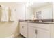 Bright bathroom features a double vanity with modern fixtures, white cabinetry, and decorative accents at 8943 Cabot Cliffs Dr, Davenport, FL 33896