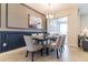 Elegant dining room featuring a formal table setting, chic chairs, and a decorative chandelier at 8943 Cabot Cliffs Dr, Davenport, FL 33896