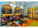 This game room features driving and skill games for the whole Gathering at 8943 Cabot Cliffs Dr, Davenport, FL 33896