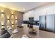 Bright kitchen with stainless steel appliances, a large island, and decorative wall lighting at 8943 Cabot Cliffs Dr, Davenport, FL 33896