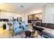 Stylish living room with an open layout, comfortable seating, and modern decor at 8943 Cabot Cliffs Dr, Davenport, FL 33896