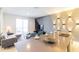 Living room with an open layout, modern decor, and a sliding glass door leading to the outdoor area at 8943 Cabot Cliffs Dr, Davenport, FL 33896