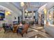 The lobby is tastefully appointed with comfortable seating and unique decorative lighting at 8943 Cabot Cliffs Dr, Davenport, FL 33896