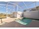 Enclosed pool area with a view of the outdoors, providing a private and relaxing retreat at 8943 Cabot Cliffs Dr, Davenport, FL 33896