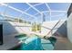 A stunning screened-in private pool offers a refreshing escape, complemented by sunlight and tranquil backyard views at 8943 Cabot Cliffs Dr, Davenport, FL 33896