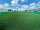 Community soccer field featuring lush green grass, modern fencing, and well-maintained landscaping at 8943 Cabot Cliffs Dr, Davenport, FL 33896