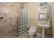 Clean bathroom with a glass block shower and pedestal sink at 2115 Lake Crescent Ct, Windermere, FL 34786