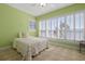 Light and airy bedroom with plantation shutters and lake views at 2115 Lake Crescent Ct, Windermere, FL 34786