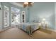 Bright bedroom featuring a ceiling fan and large windows at 2115 Lake Crescent Ct, Windermere, FL 34786