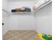 Spacious walk-in closet with shelving and carpeted floor at 2115 Lake Crescent Ct, Windermere, FL 34786