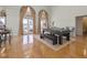 Bright game room with pool table, hardwood floors and lake view at 2115 Lake Crescent Ct, Windermere, FL 34786