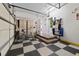 Checkerboard floor, bicycle, and ample storage in this garage at 2115 Lake Crescent Ct, Windermere, FL 34786