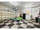 Spacious garage with kayaks, paddleboards, and overhead storage at 2115 Lake Crescent Ct, Windermere, FL 34786