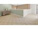Upstairs hallway with neutral carpeting and a modern console at 2115 Lake Crescent Ct, Windermere, FL 34786