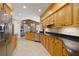 Spacious kitchen with light wood cabinets, granite countertops, and stainless steel appliances at 2115 Lake Crescent Ct, Windermere, FL 34786