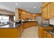 Large kitchen with island, corner sink, and views to the lake at 2115 Lake Crescent Ct, Windermere, FL 34786