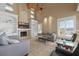 Relaxing living room with fireplace, built-in shelving, and lake views at 2115 Lake Crescent Ct, Windermere, FL 34786