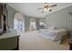 Large main bedroom with water views, ample closet space and ensuite bathroom at 2115 Lake Crescent Ct, Windermere, FL 34786