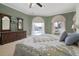 Main bedroom with lake views, large bed, and ample natural light at 2115 Lake Crescent Ct, Windermere, FL 34786