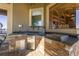 Outdoor kitchen with stone counters and stainless steel appliances at 2115 Lake Crescent Ct, Windermere, FL 34786