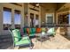 Relaxing outdoor patio with seating and a stone grill at 2115 Lake Crescent Ct, Windermere, FL 34786