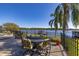 Enjoy the lake view from this patio dining area at 2115 Lake Crescent Ct, Windermere, FL 34786