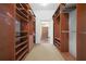 Large walk-in closet with ample shelving and hanging space at 2115 Lake Crescent Ct, Windermere, FL 34786