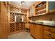 Well-appointed wine cellar with ample storage for wine bottles and glasses at 2115 Lake Crescent Ct, Windermere, FL 34786