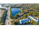 Aerial view of community with lake and nearby highway at 510 Cranes Way # 306, Altamonte Springs, FL 32701