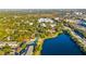 Aerial view of community featuring a lake, swimming pool, tennis court and surrounding residences at 510 Cranes Way # 306, Altamonte Springs, FL 32701