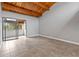 Spacious bedroom featuring a high wood ceiling, tile flooring, and sliding glass doors to a private balcony, perfect for relaxation at 510 Cranes Way # 306, Altamonte Springs, FL 32701