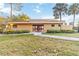 Clubhouse exterior with well-maintained lawn and landscaping at 510 Cranes Way # 306, Altamonte Springs, FL 32701