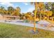 Community pool with plenty of lounge chairs, surrounded by lush landscaping at 510 Cranes Way # 306, Altamonte Springs, FL 32701