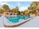 Exterior view of the sparkling community pool with a clubhouse nearby at 510 Cranes Way # 306, Altamonte Springs, FL 32701