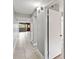 Hallway with open doors to a balcony on the left and a bedroom on the right at 510 Cranes Way # 306, Altamonte Springs, FL 32701