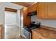 Kitchen featuring stainless-steel appliances, ample cabinet space, and an inviting breakfast bar at 510 Cranes Way # 306, Altamonte Springs, FL 32701