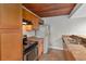 Kitchen boasting stainless-steel appliances, ample wood cabinets, and a unique wooden ceiling at 510 Cranes Way # 306, Altamonte Springs, FL 32701